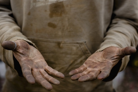 Close up of a man dirty hands