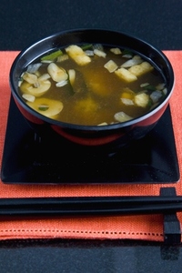 Close up of a place setting with a serving of miso soup