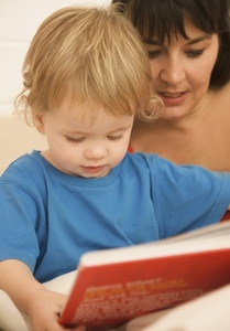 Woman with a child reading a bedtime story