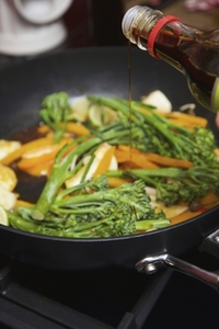 Adding Soy Sauce to Vegetable Stir Fry