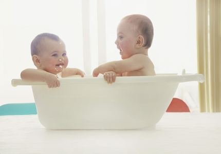 Baby Twins Having a Bath