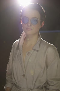 Young Woman Wearing Trenchcoat and Blue Tinted Sunglasses