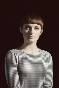 Young Woman with Blunt Fringe and Black Eyeliner