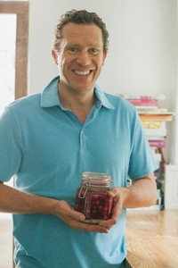 Man Holding Mason Jar with Cherry Vodka