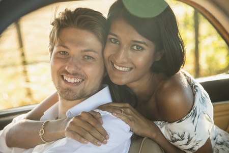 Portrait of Smiling Couple inside Car