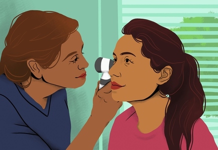 Female doctor examining ear of patient with otoscope in clinic exam room