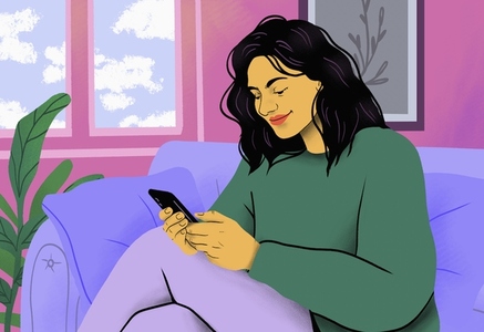 Smiling woman relaxing using smart phone on living room sofa