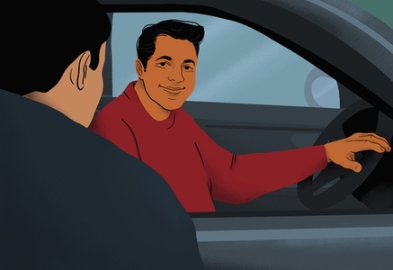 Smiling man behind steering wheel talking to friend at car window