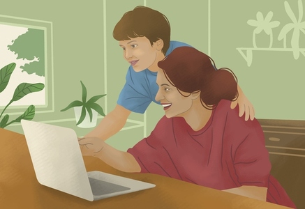Happy mother and son using laptop together at home