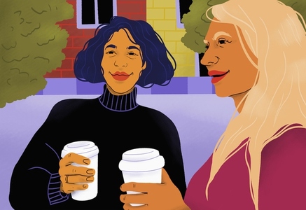 Women friends drinking coffee in park