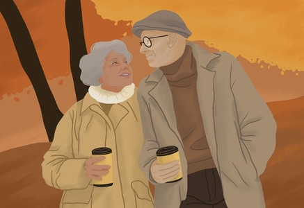 Happy senior couple walking with coffee in autumn park