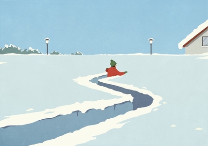 Man walking creating path in deep winter snow