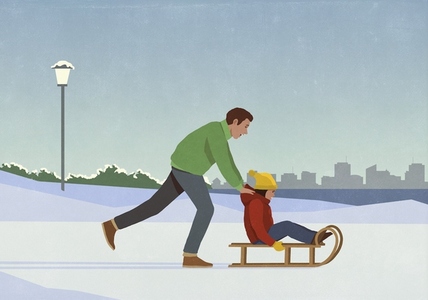 Father pushing daughter on sled in snowy winter city park