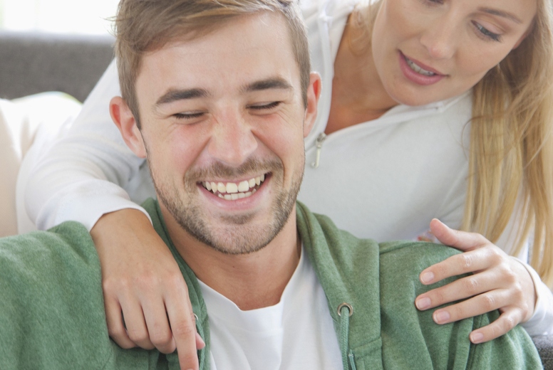 Couple on Sofa Using Laptop