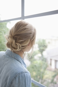 Back View of Woman Looking out of Window