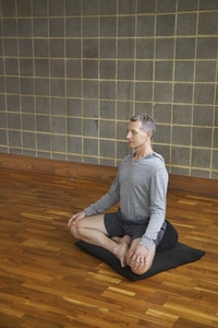 Mature Man Practicing Yoga Easy pose