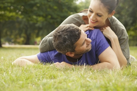 Smiling Couple Lying on Grass