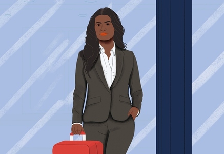 Businesswoman with suitcase traveling in airport