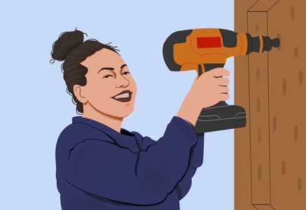Portrait smiling woman using power drill