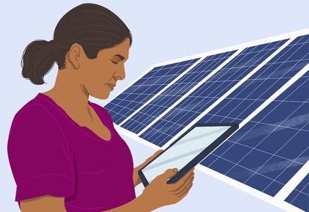 Woman with digital tablet standing at solar panels