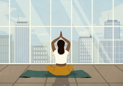 Woman practicing yoga meditation at window with cityscape view