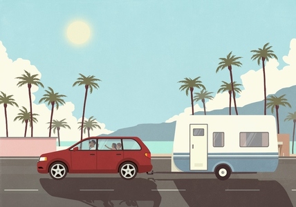 Family on vacation in car pulling camper trailer along sunny palm trees and ocean