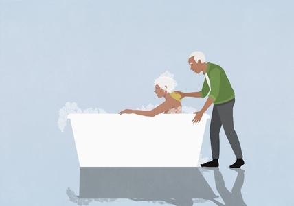 Affectionate senior husband scrubbing wife s back in bubble bath