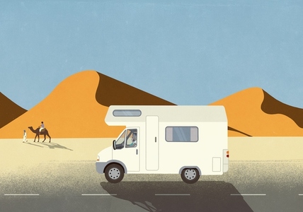 Man on vacation driving RV along sand dunes in desert