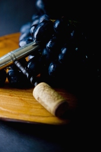 Black Wine Grapes and Corkscrew
