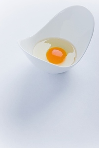 Uncooked Egg in White Container