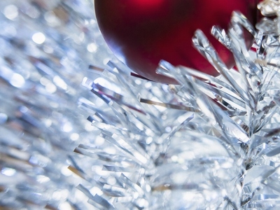 Close up of Red Christmas Bauble and Silver Tinsel