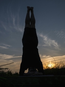Man Practicing Yoga Outdoors at Sunset
