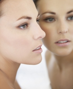 Profile of Woman Face and Mirror Image