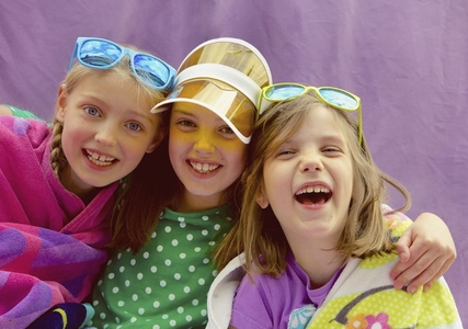 Young Girls Wearing Visor and Sunglasses Smiling