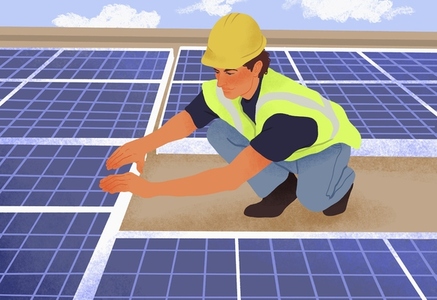 Male engineer installing solar panels on roof