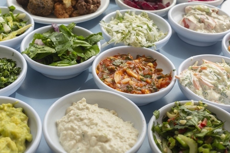Close up still life of Israeli meze appetizers in bowls