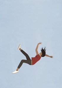 Woman falling midair against blue background