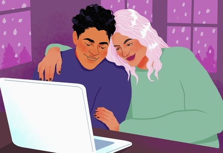 Happy  affectionate couple using laptop and hugging at home
