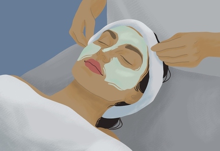 Serene woman receiving facial treatment in spa