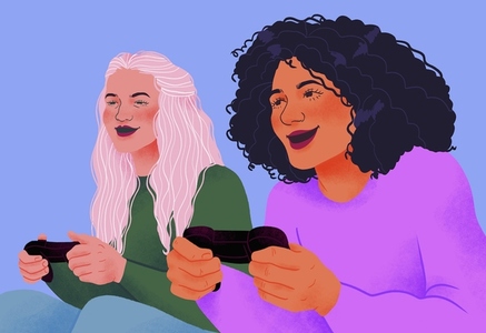 Happy women friends playing video game together