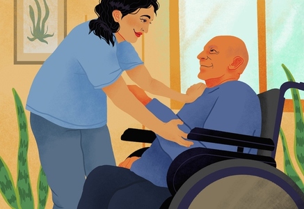 Smiling friendly home caregiver helping senior man in wheelchair