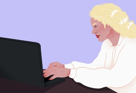 Businesswoman working at laptop