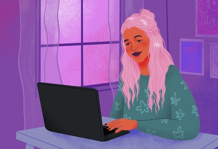 Smiling teenage girl using laptop in bedroom at home