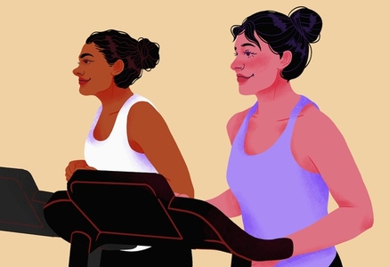Smiling women exercising on treadmills in gym