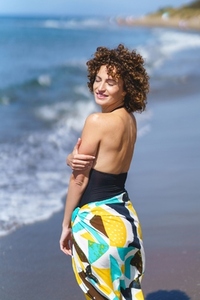 Sensual woman standing on beach