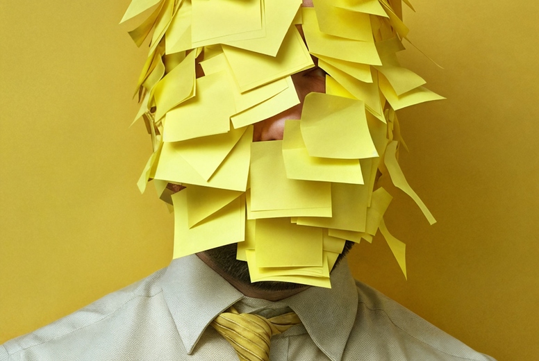 A face covered with post-its.