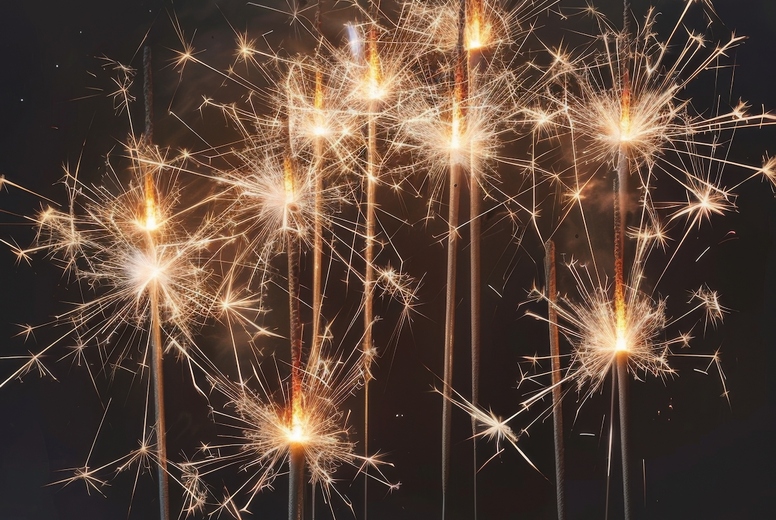 Sparklers on a black background.