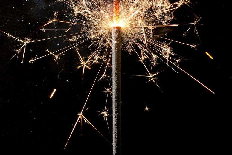 Sparkler on a black background.