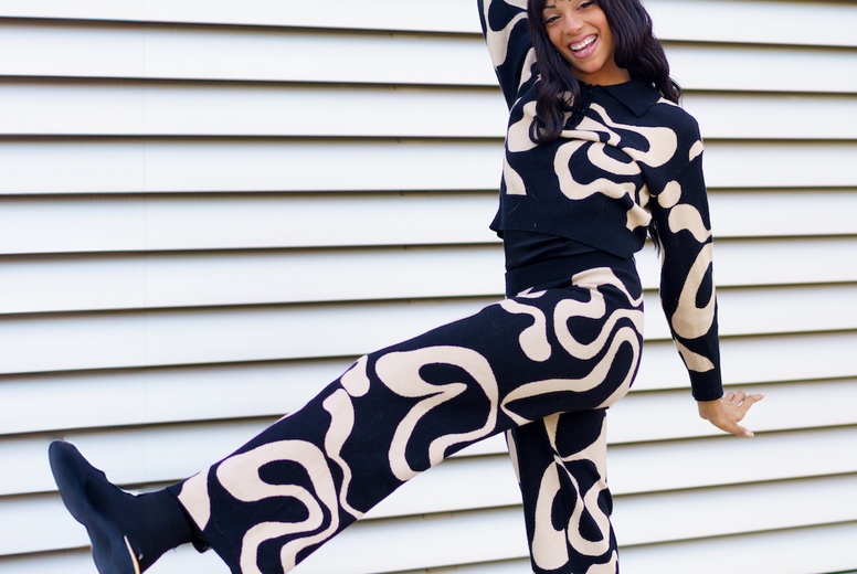 Dancer performing free style raising the leg in the street