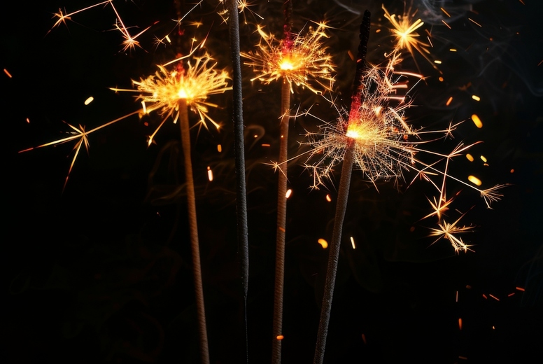 Sparklers on a black background.
